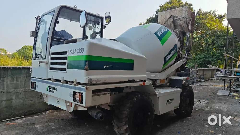 Self loading concrete mixer