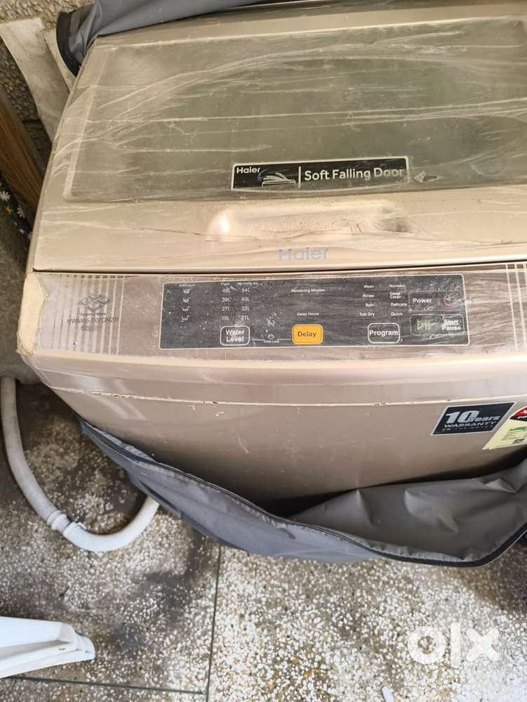 Haeir 6.5 ltrs washing machine and TV Cabinet