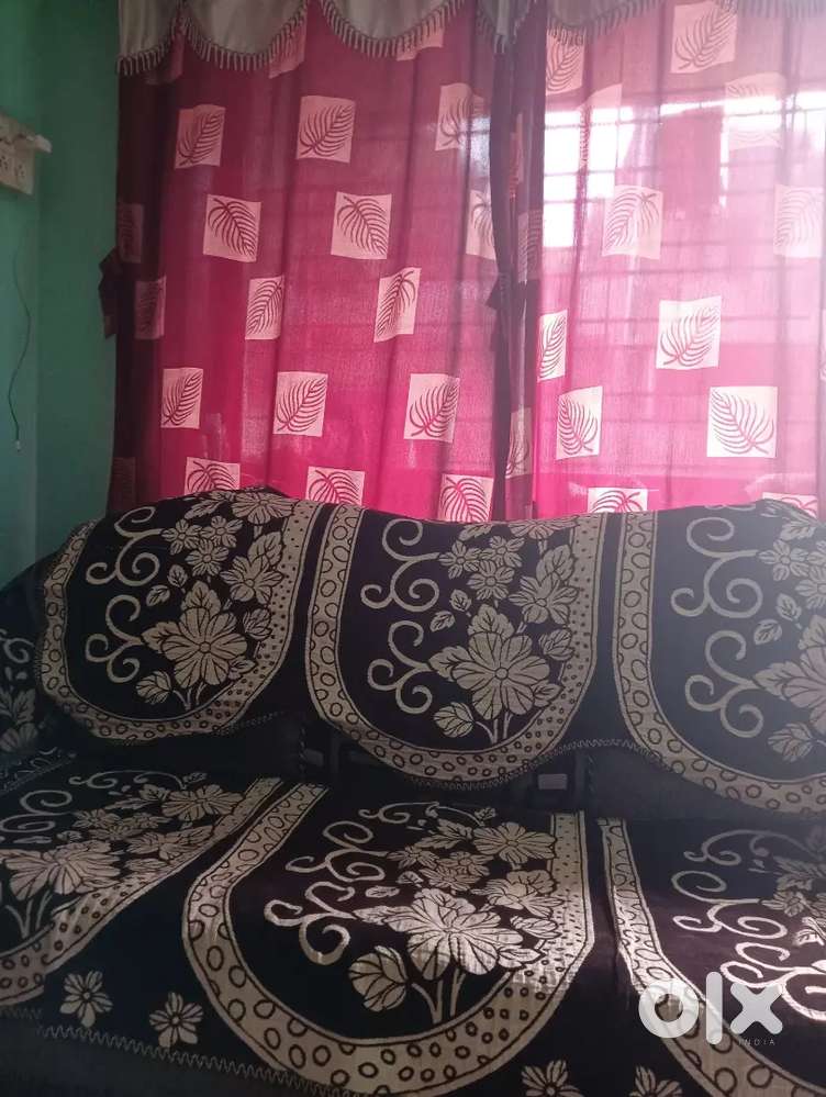 Sofa with 1 chairs good condition blackish colour