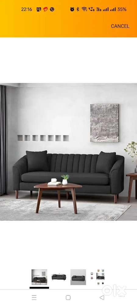 Stylish black velvet sofa