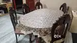 Wooden Dinning table with Glass top and six chair.
