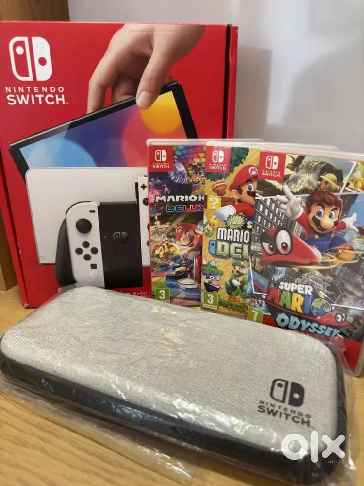 Nintendo Switch OLED model bundle inc SEVEN games & case, mint, A