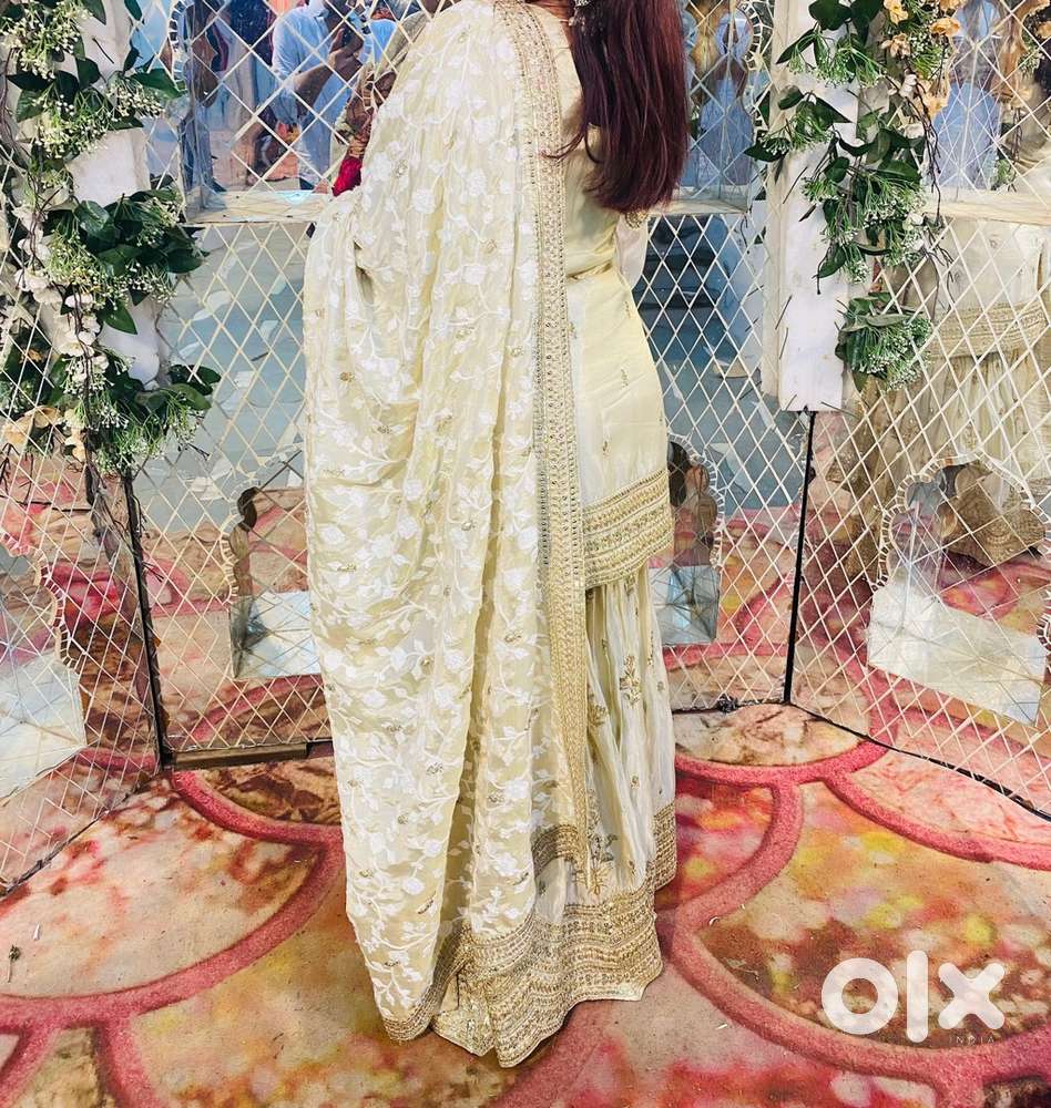 A cream colour beautiful indian dress for partys and weddings