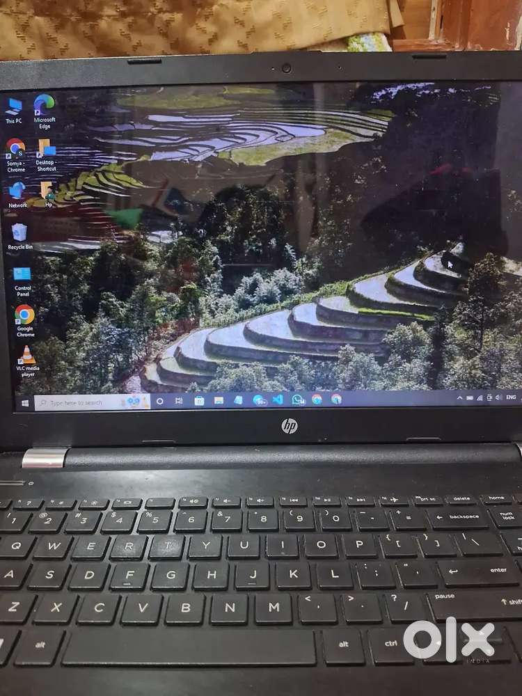 HP laptop with charger and keyboard cover
