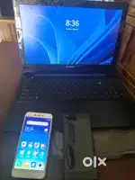 Lenovo laptop with two phones