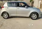 Officer owned and driven swift silver color diesel car.
