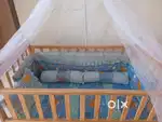 Wooden baby cradle / bed with a mosquito net