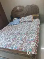 King size double bed made of teak wood.