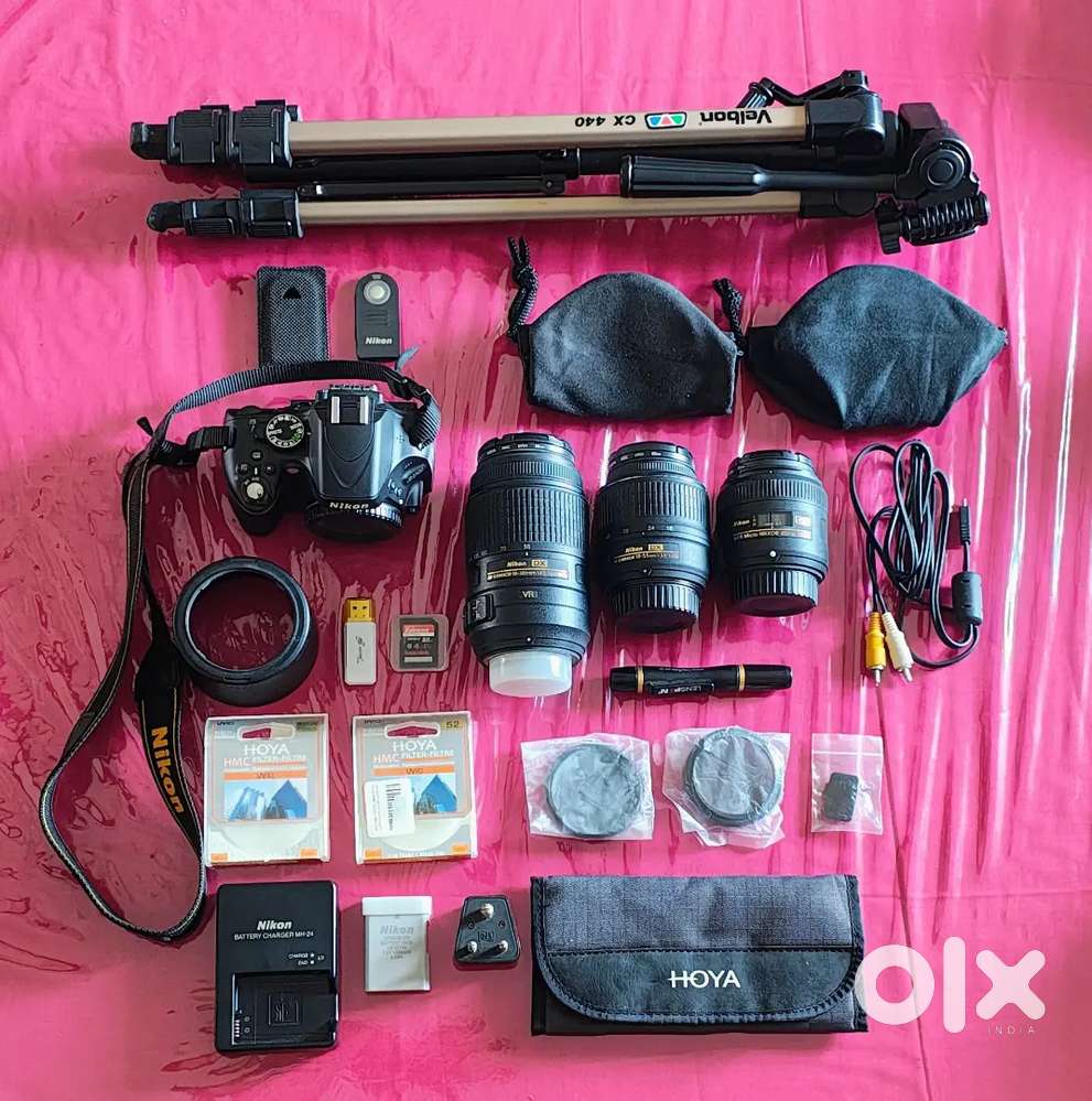 Nikon D5100 with three lenses, tripod, and accessories