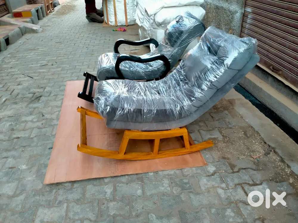 Wooden rocking chair in teak wood