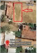 Empty land with back and side compound walls and properly leveled