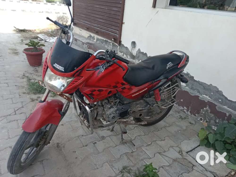 The rear tire is new and the front tire is half worn.