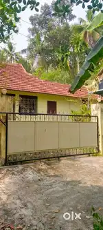 Back portion of tiled house with bedroom