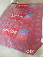 Red mattress king size and white pillo