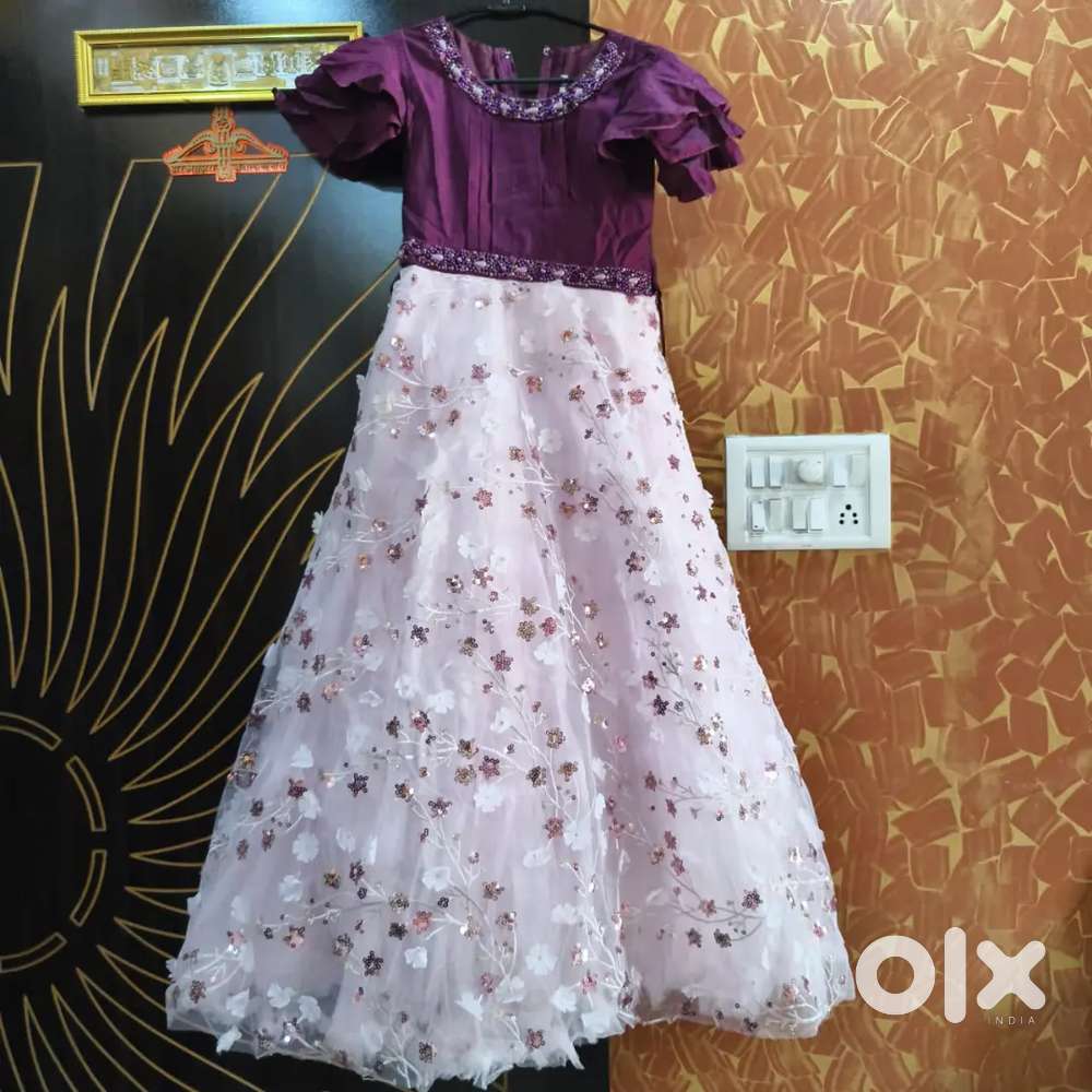 It's a frock of purple and pink colour