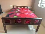 Double cot (bed) with mattress.