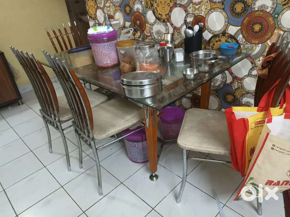 Glasstop dining table with chairs