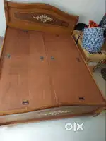 Wooden queen size storage bed