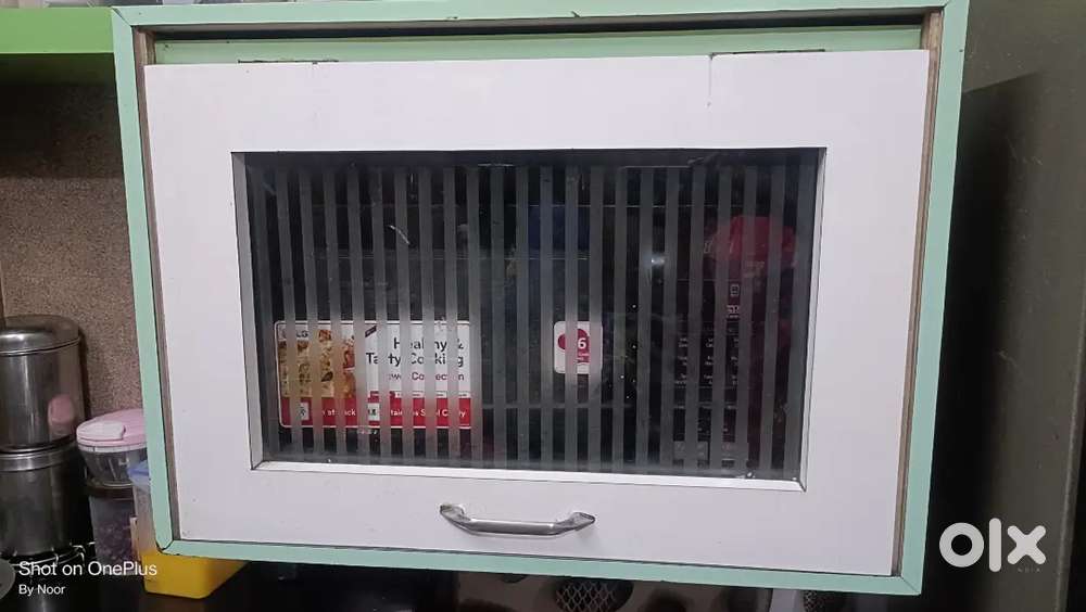 Storage cabinet for oven