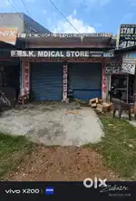2 shop hai noorpur road pe uske piche plot hai 262 metr ka