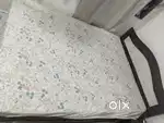 Double bed with side table