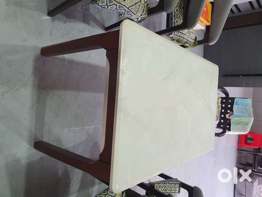 4 seater onex marbal top brand new dining table with solid wooden base