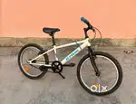 Btwin racing boy 300 bi cycle for kids white color with stand