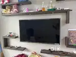 Samsung 43 inch TV, Small Microoven and Adjustable metal rack.
