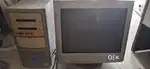 Bulky HP computer with printer, UPS and multiple speakers