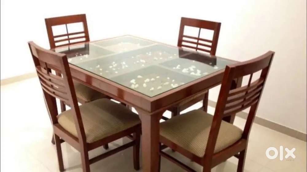 Dinning table with glass available in starf dream furniture