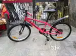 Two btwin cycles one with gears and one normal