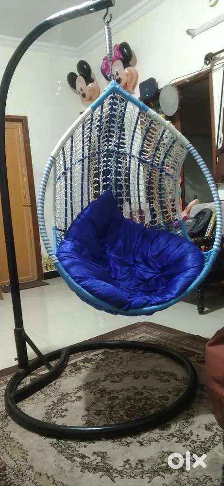 Swing in mint condition with stand for sale.
