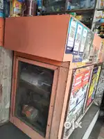 Wants to sell wood counter with 3 glass windows, ( 2 front +1 side)