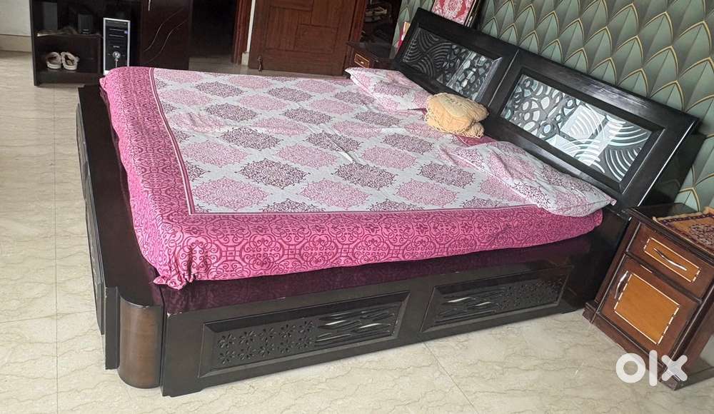 Double bed with boxes and side tables