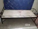 A cot with mattress