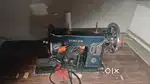 Sewing machine with stand and motor