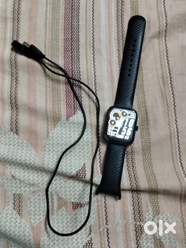 Noise smart watch with its charging cable