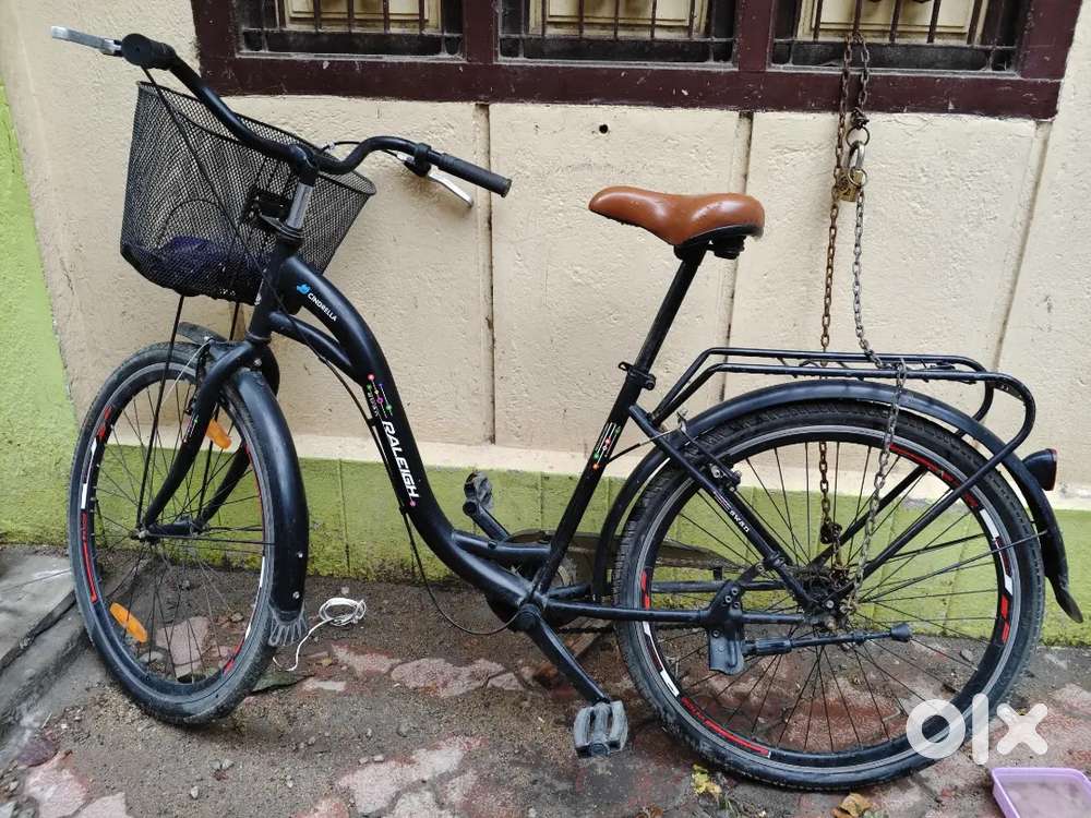 This is a black Raleigh Cindrella city bicycle