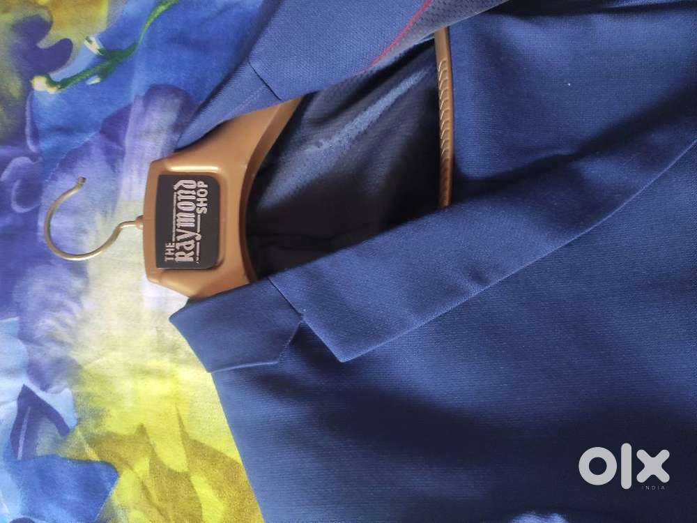 Premium Navy Blue Raymond Suit.for men from age 16 to 26.