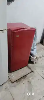 Red colour single door fridge proper working condition