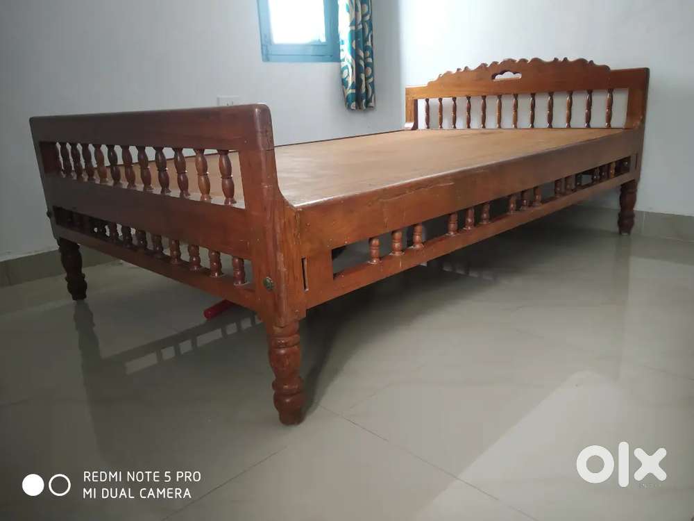 Bed with Mettares and Wall mount Mirror.