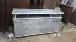 T.V base at factory cost