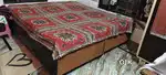 A dynamic duo of double bed and a folding bed