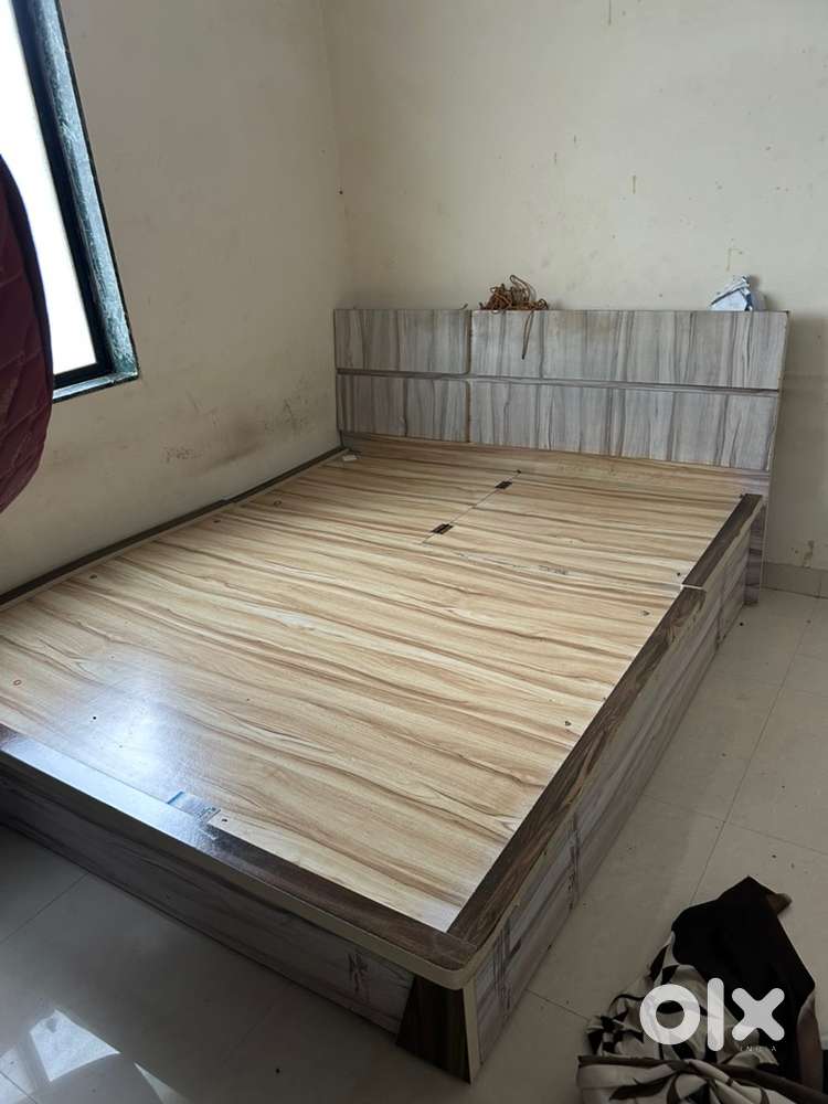 A Queen size bed, dressing table and side table