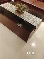 Centre table. Wooden  with glass top.