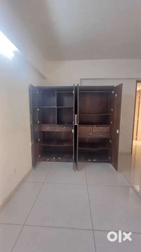 Four door wardrobe and 2 seater swing.