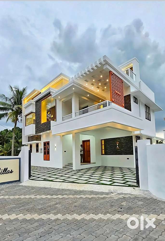 5.5cent new house for sale at kariyavattom 2400sq redbricks 1.25cr