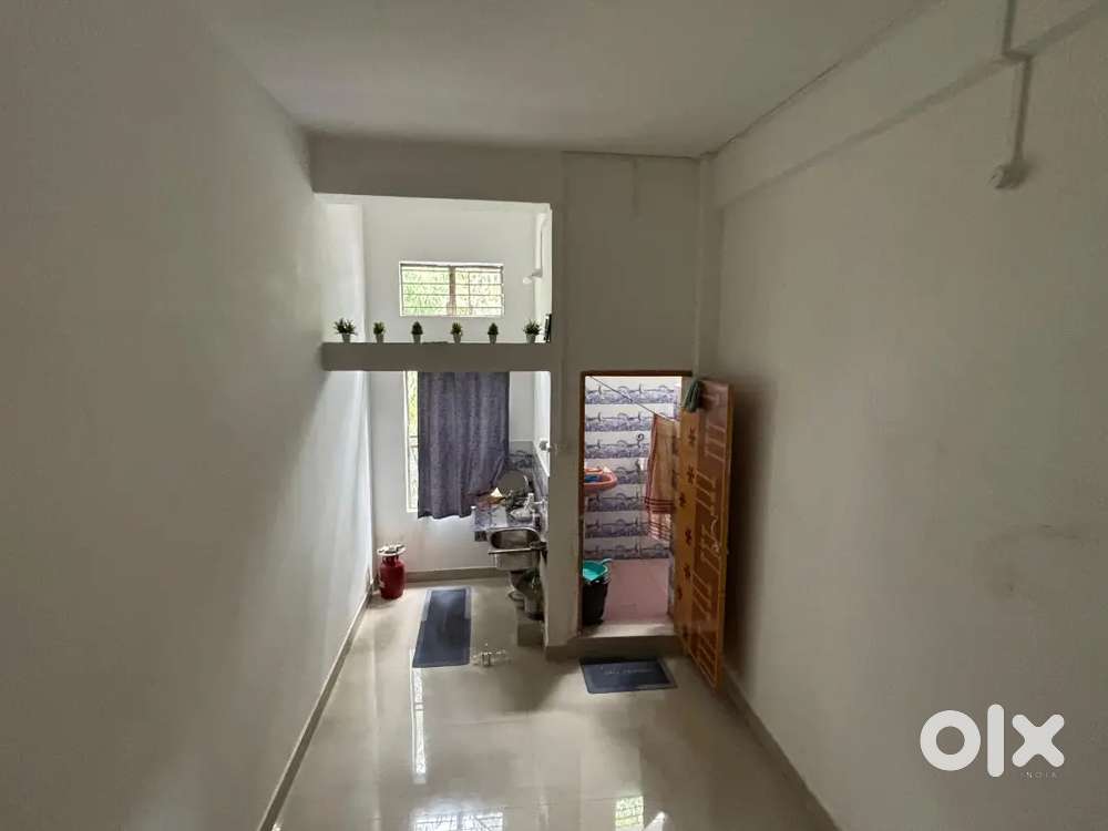 Single room with attached toilet, kitchen, running water.