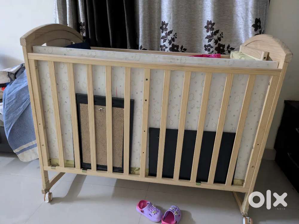 HunyHuny Super Comfy Wooden 12 in 1 Rocking Cot with storage.