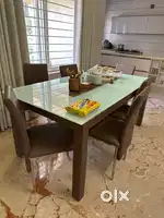 Dinining table 6 searer , leather cum glass finish